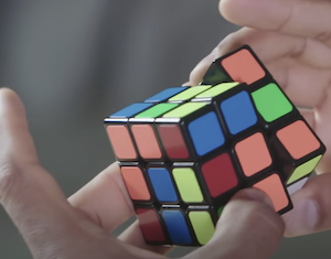 Person working Rubik's cube, problems solving